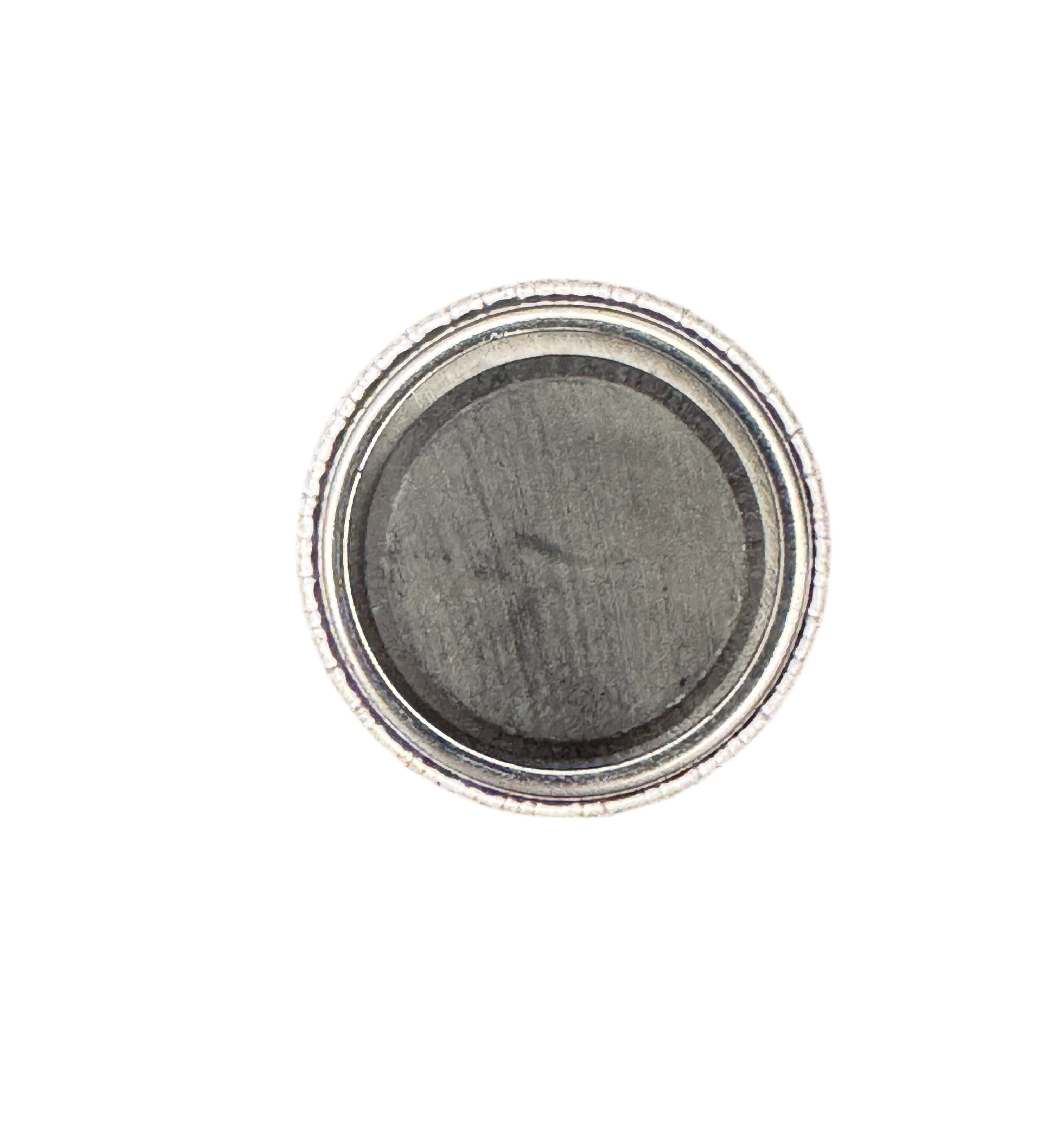 1 inch badge with magnet attached with permanent adhesive on white background 