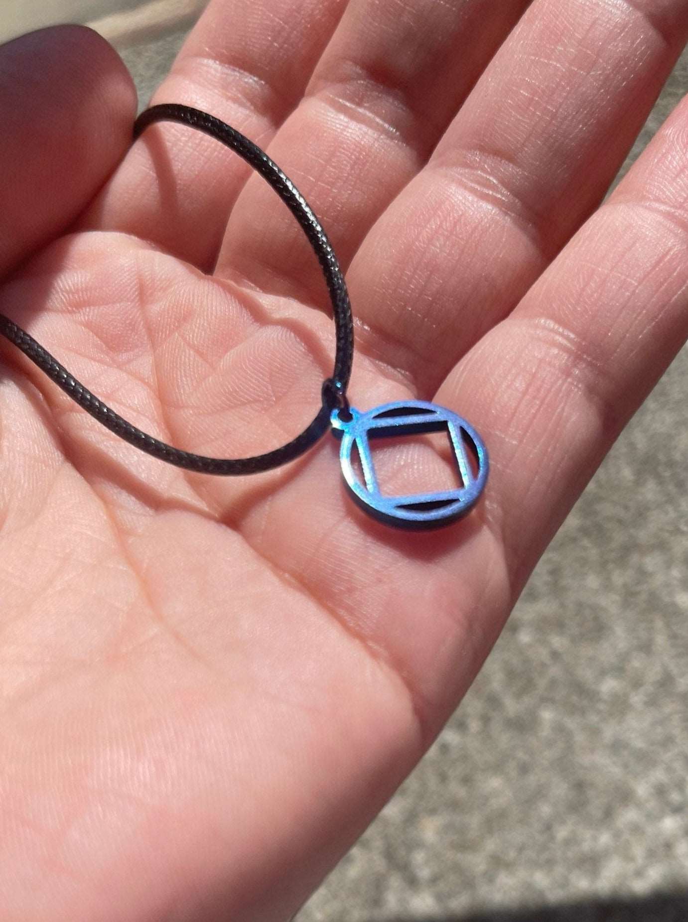 Blue Stainless Steel Narcotics Anonymous Symbol Necklace.