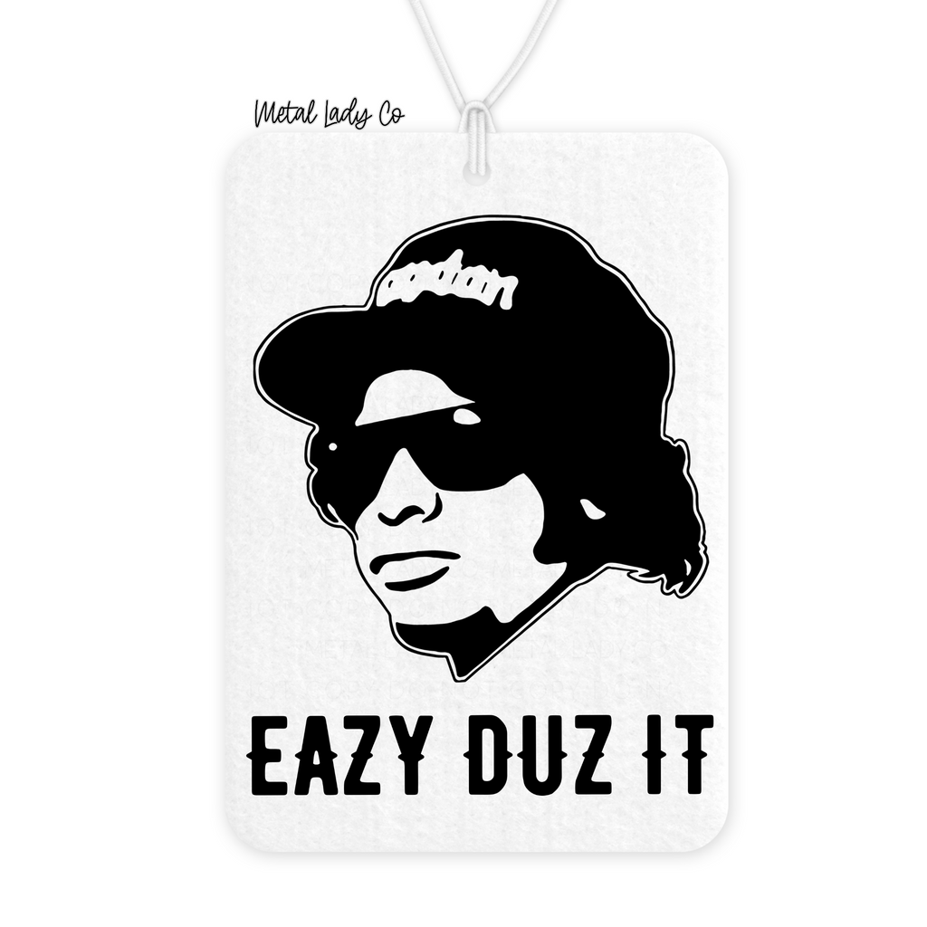 A black and white car air freshener featuring a graphic of Eazy-E with the text 'Eazy Duz It'.