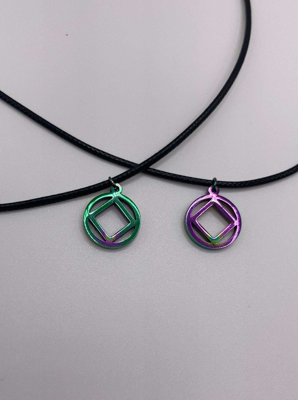 MetalLadyCo NA Charm Necklace with green and purple geometric pendants on black cords