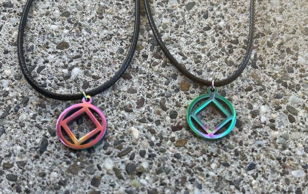 MetalLadyCo NA Charm Necklace with colorful geometric metal pendants on black cords