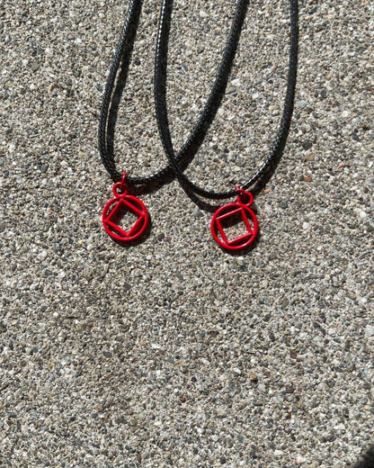 Red Coated Stainless Steel NA symbol necklace