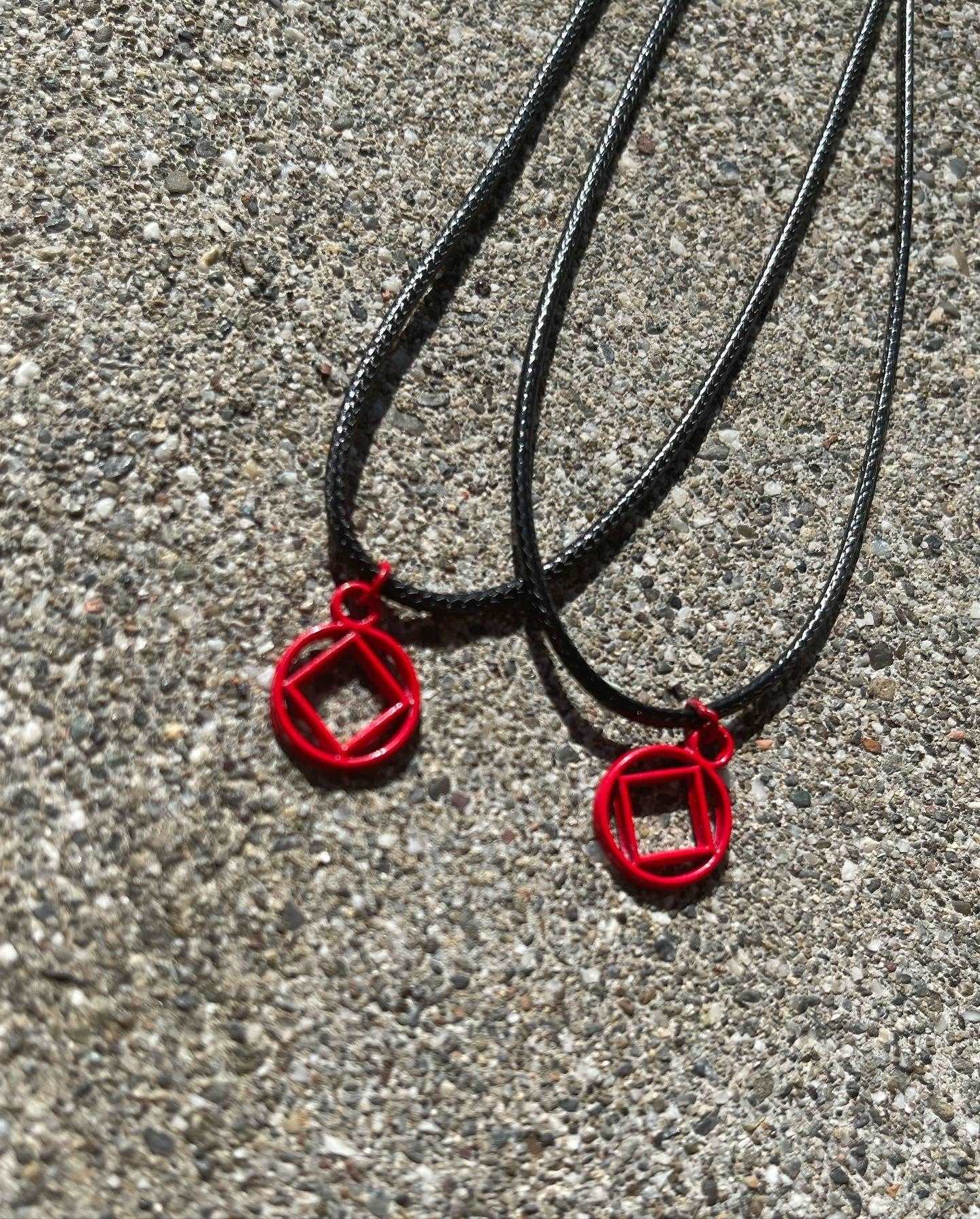 Red Coated Stainless Steel NA symbol necklace