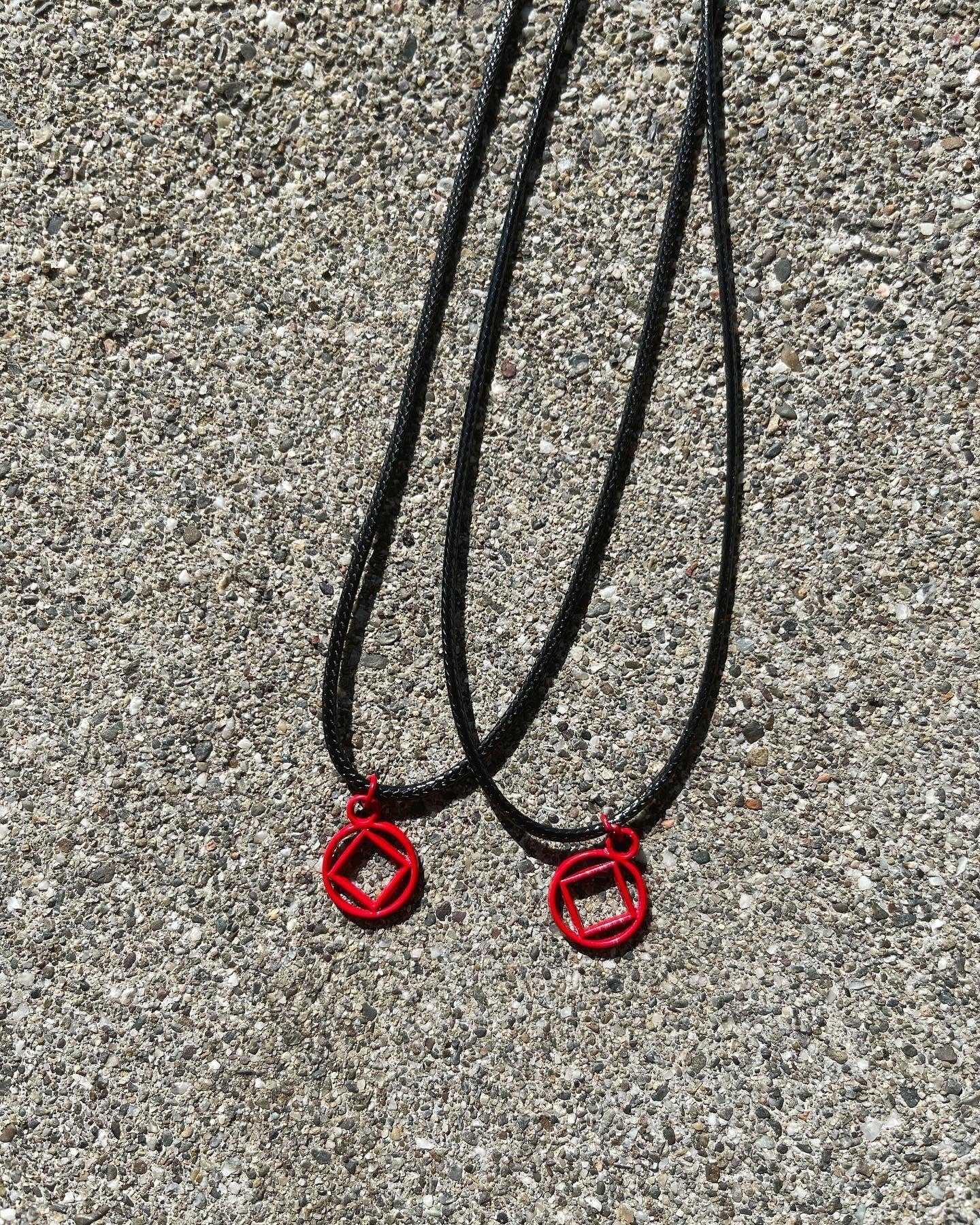 Red Coated Stainless Steel NA symbol necklace