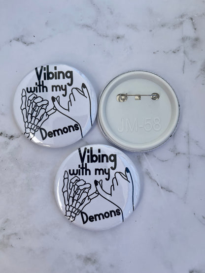 Vibing with my demons pinback button