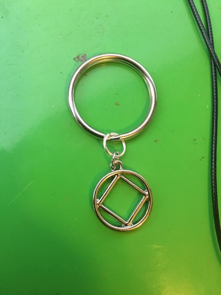 Na symbol keychain 3/4 inch alloy